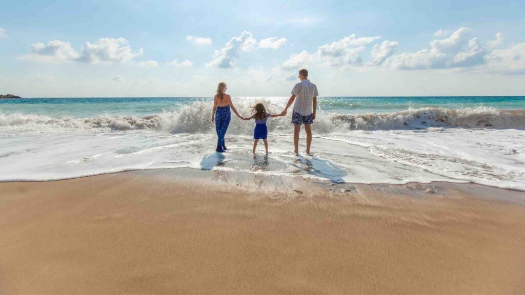 parents walking on the beach