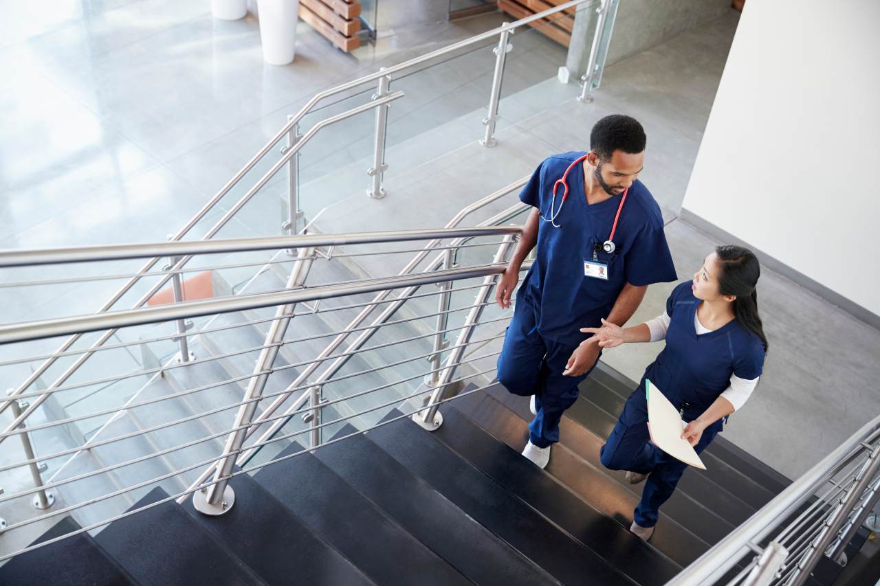LPNs working jobs in hospitals and walking on stairs