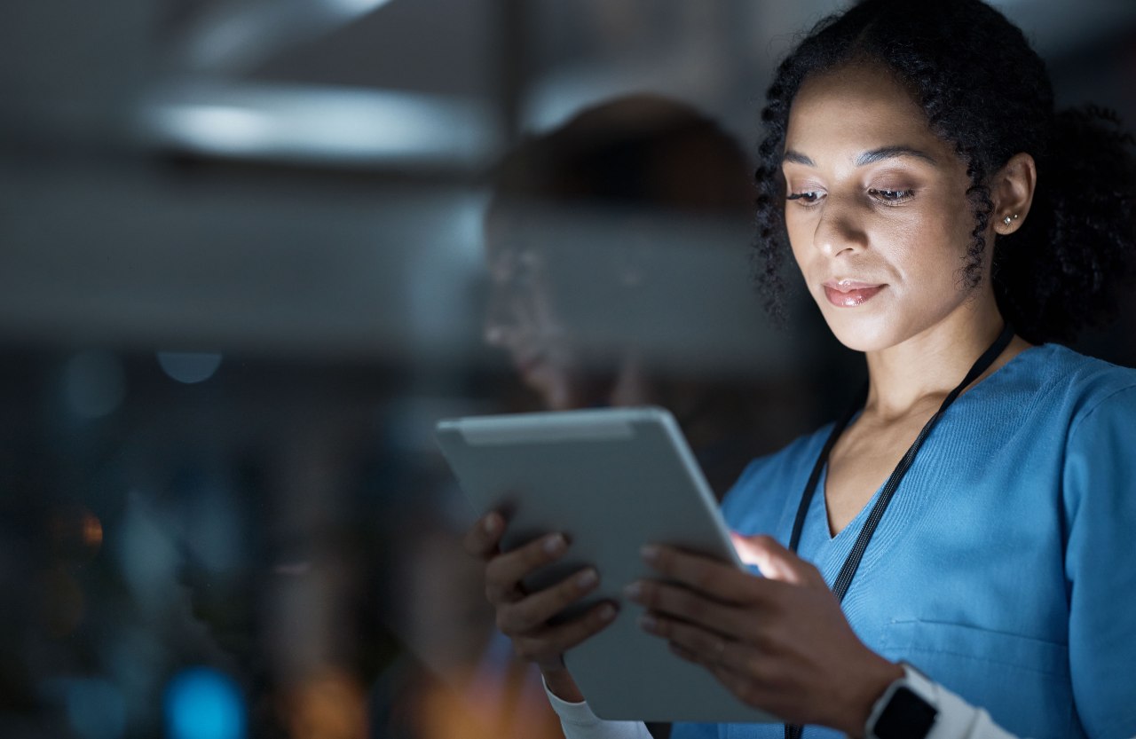 picture of a new nurse picking up jobs with a mobile app