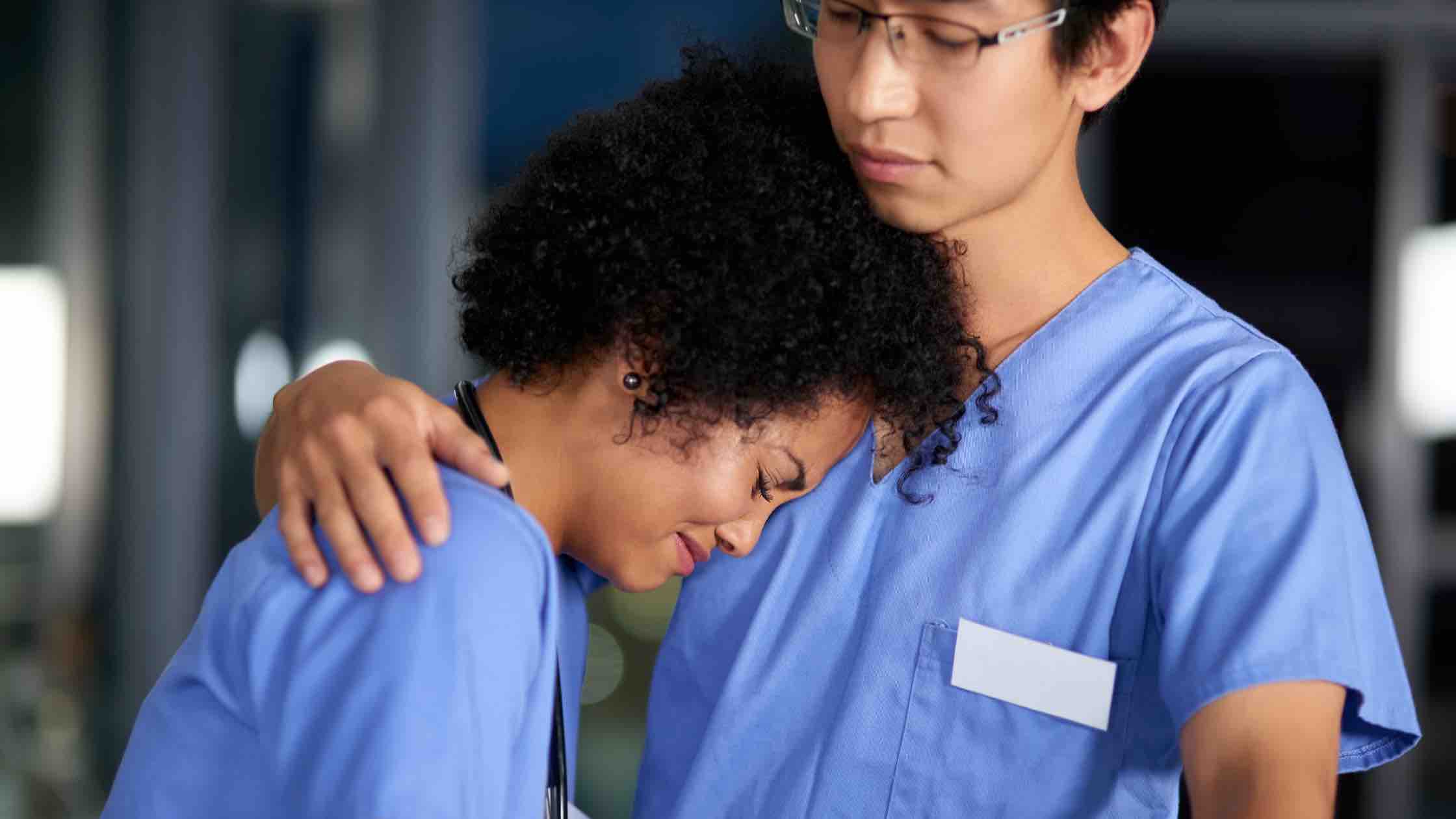 nurse crying on other nurse 