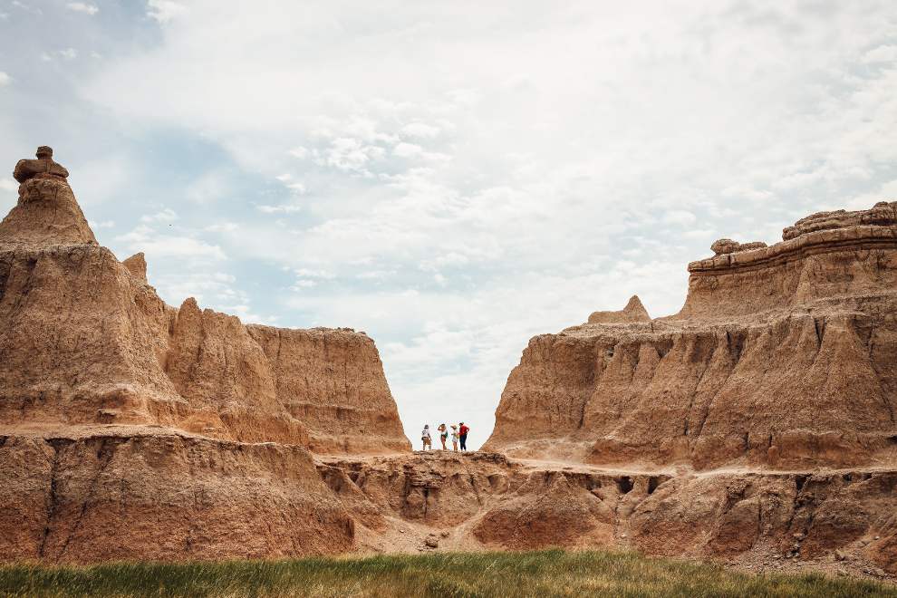 picture of people standing in mountain range in South Dakota