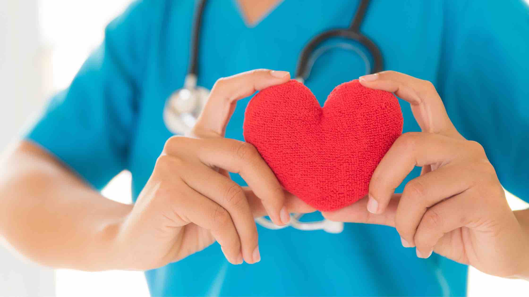 nurse holding a heart