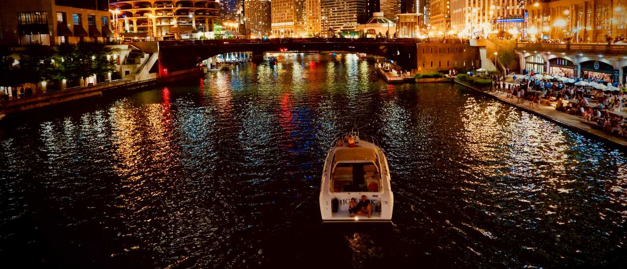 river running through Chicago at night with lights