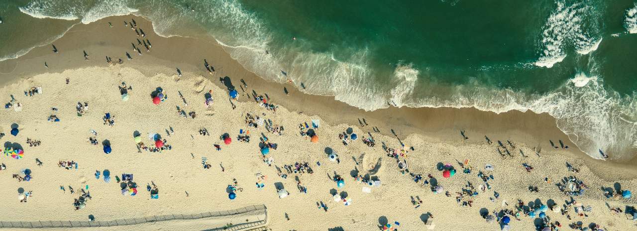 people walking along Long Island Beach in New Jersey