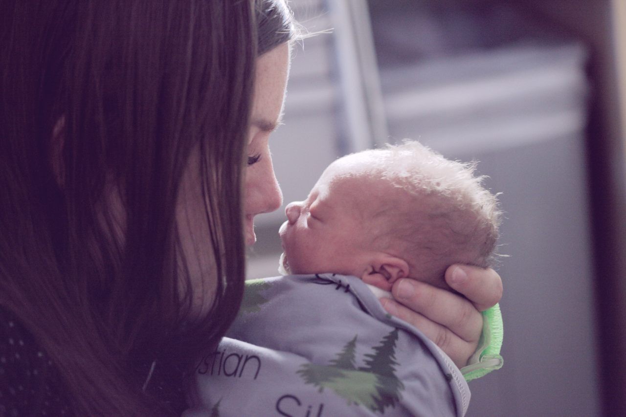 mother holding a premature baby