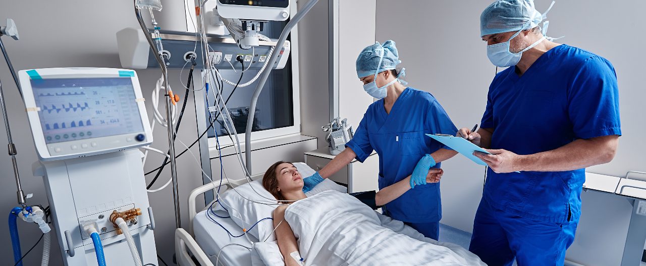 two ICU nurses performing a shift report and handoff