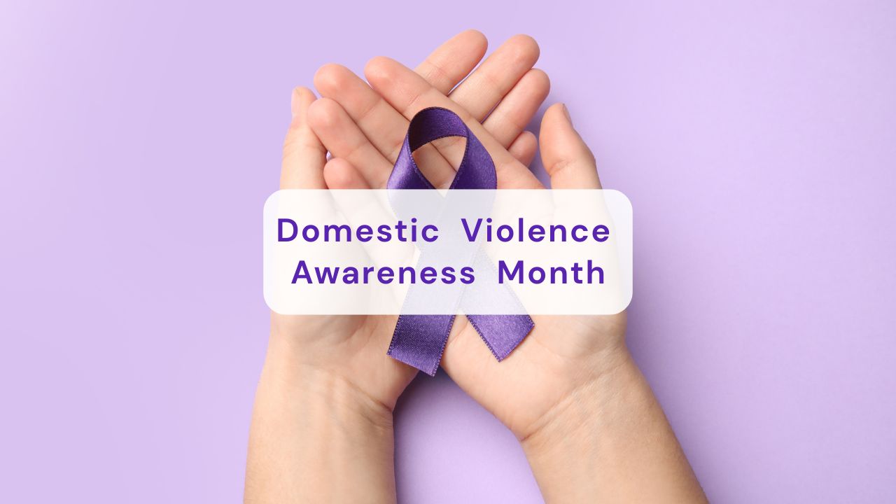 hand with a purple ribbon