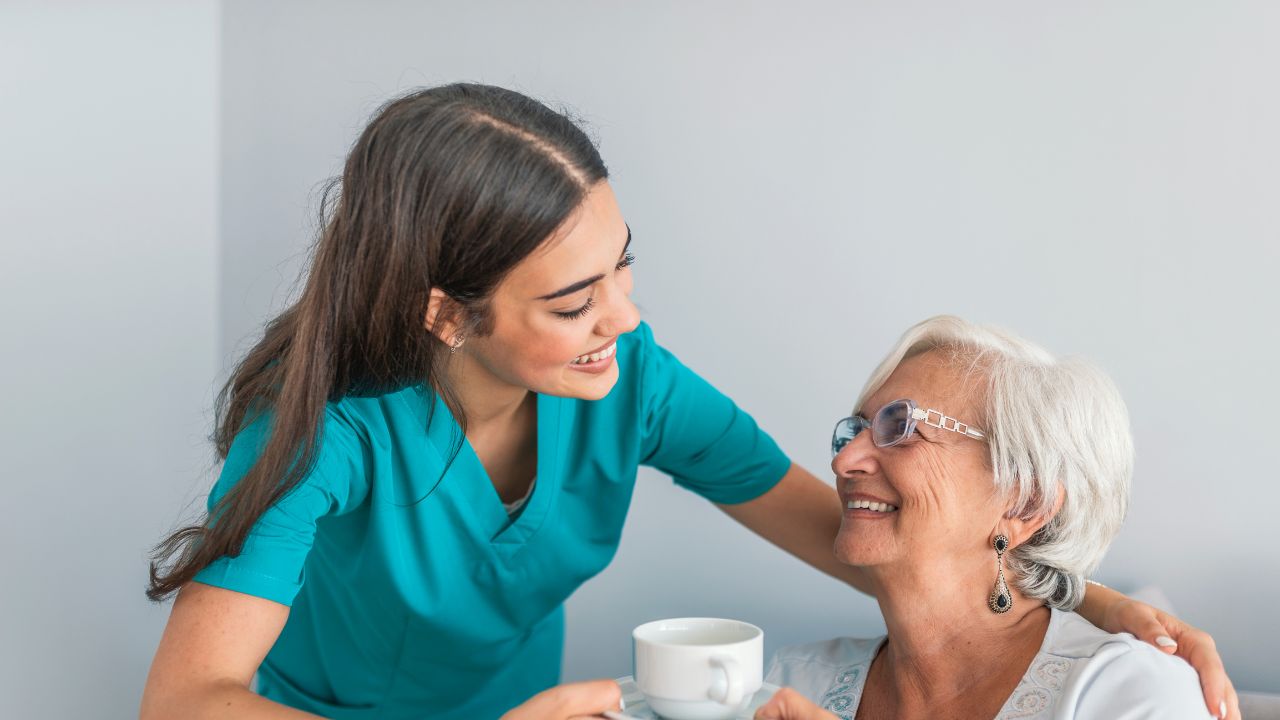 CNA working next to a patient
