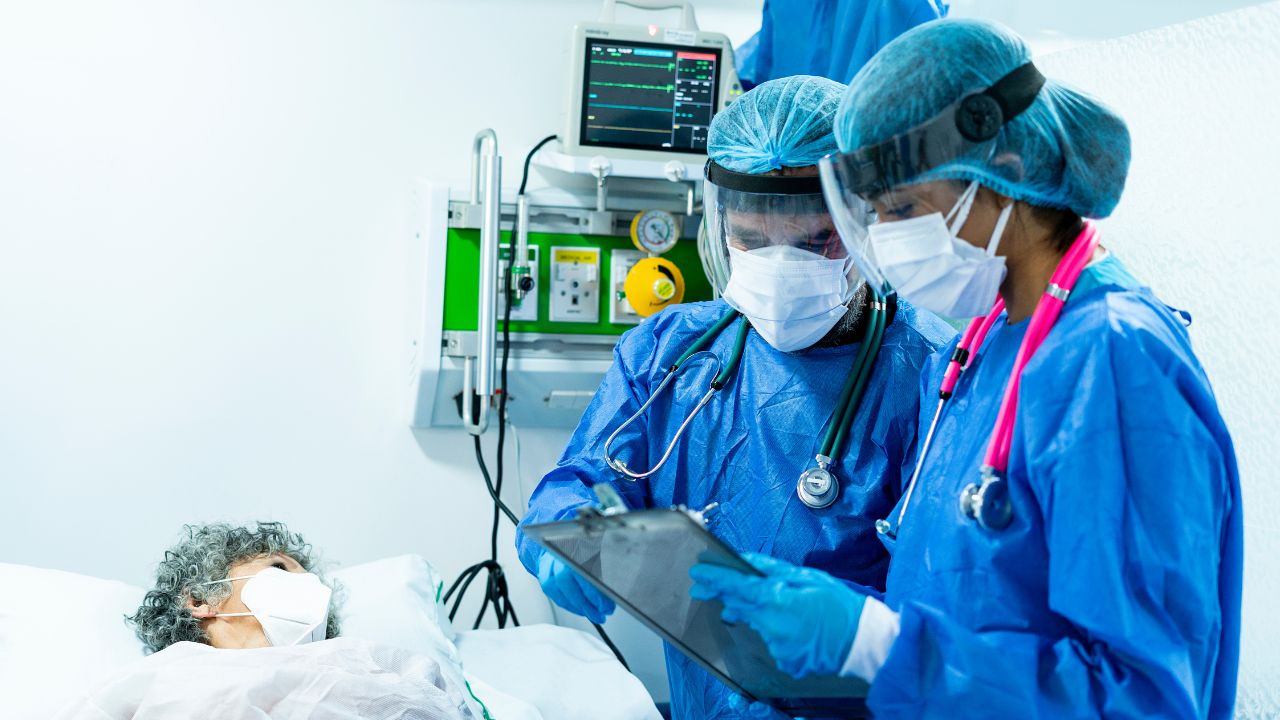 two nurses looking at a chart in an acute care setting